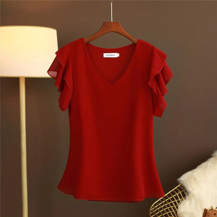 Light women's silk chiffon blouse with ruffled sleeves and V-neck