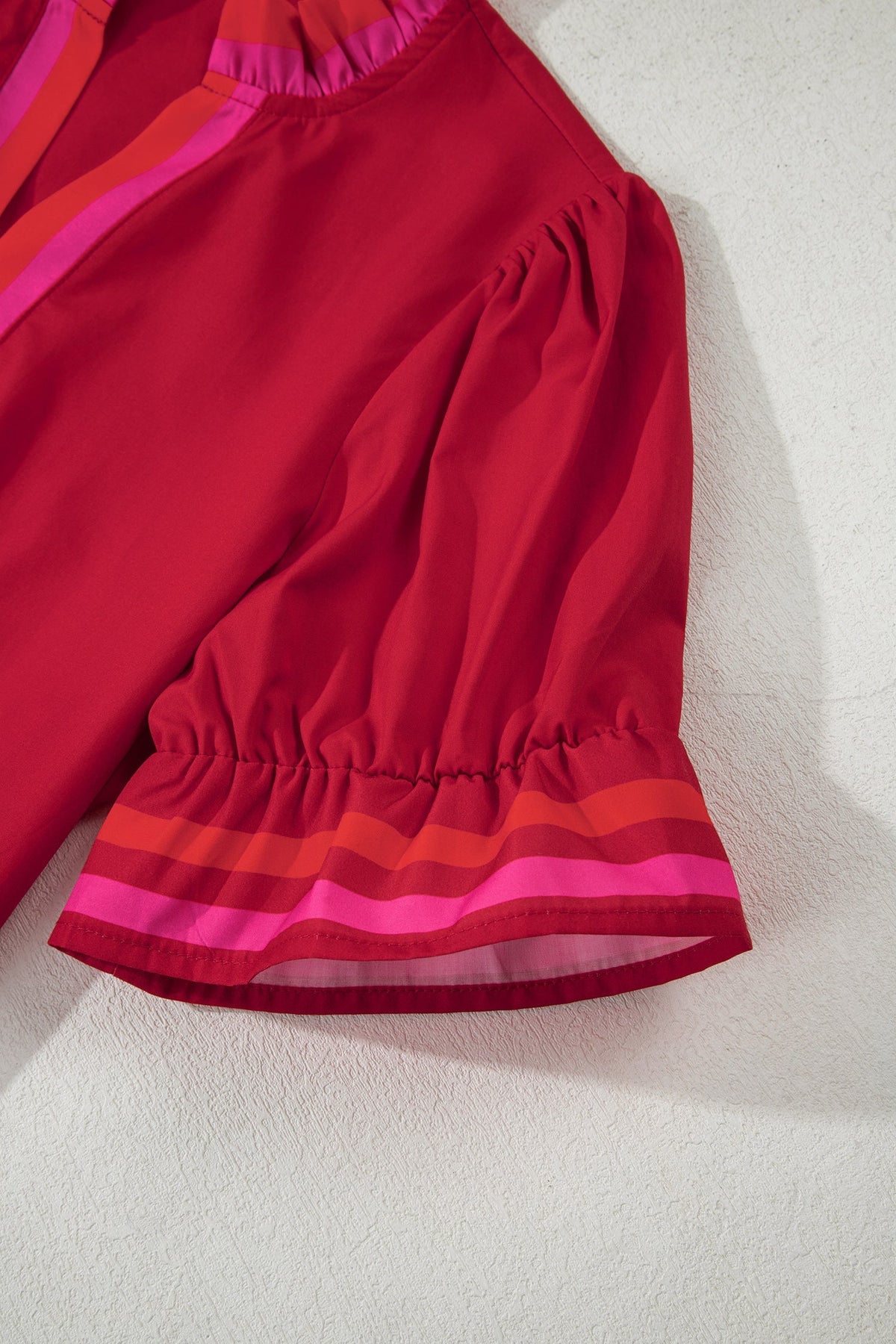 Fire red striped blouse with ruffled collar and short puffed sleeves