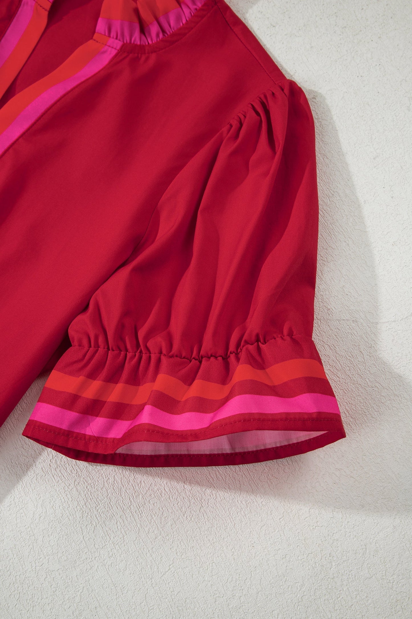 Fire red striped blouse with ruffled collar and short puffed sleeves